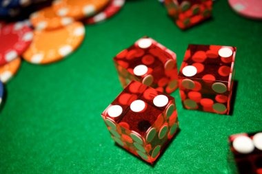 Live casino dealer at roulette table with multi-camera setup